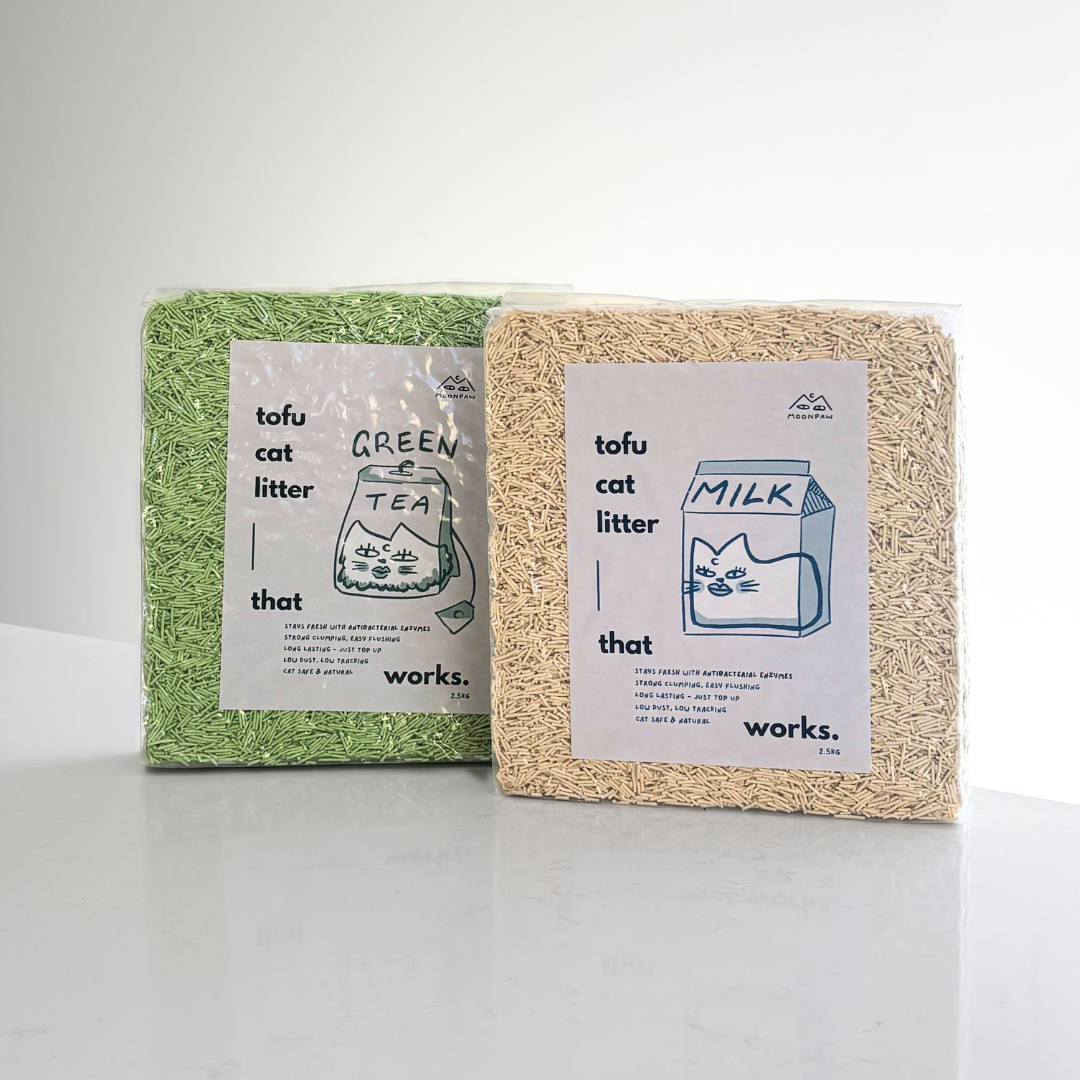 Two blocks of tofu cat litter, one green tea scent and one milk scent